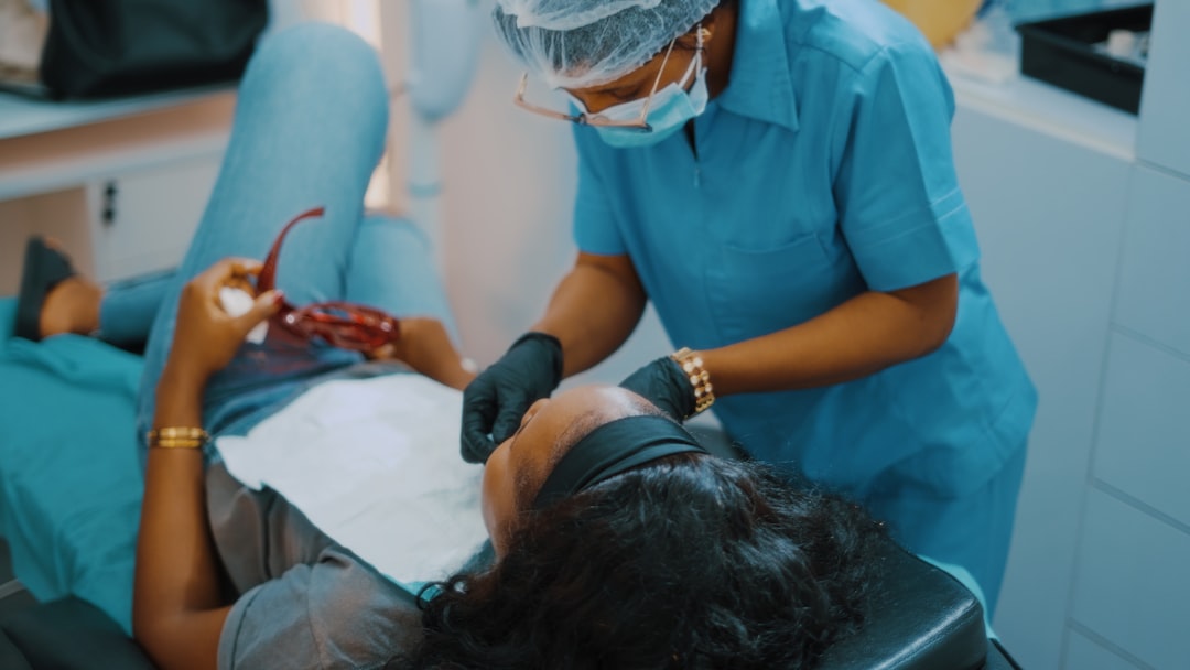 Berkeley dentist checking a patient's tooth to decide between a root canal and a filling