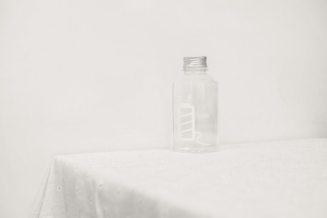 Small glass bottle on a table representing a home toothache remedy that has stopped working after 48 hours.