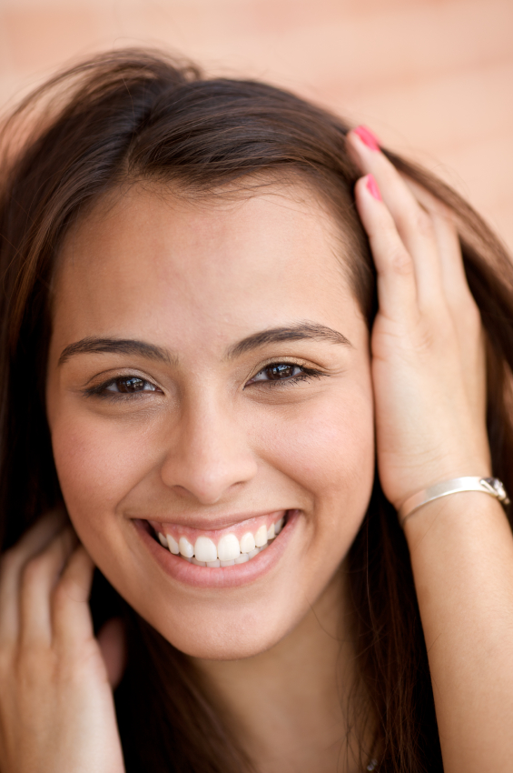 Woman smiling with dental inlays and onlays by dentist in Berkeley, CA.