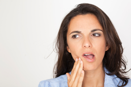 Woman with jaw pain who could use TMJ therapy at Dailley Dental Care