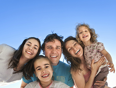 Happy family smiling outdoors