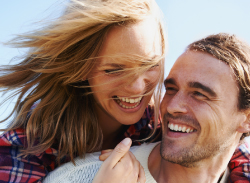 young man and woman laughing