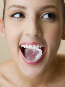 Woman Biting on Ice