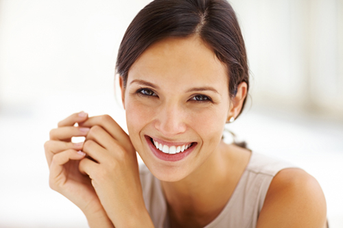 Woman smiling after crown lengthening from Dailley Dental Care