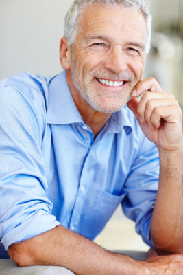 Man smiling with dentures from Dailley Dental Care